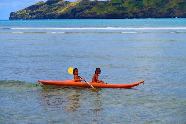 Anaho Beach children canoe Nuku Hiva Marquesas Islands French Polynesia