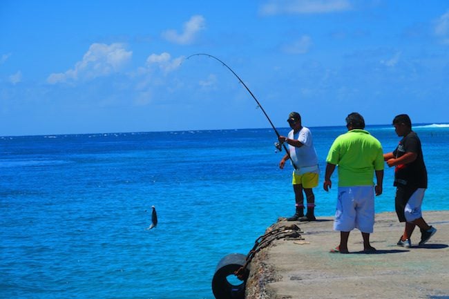 Fishing off the pier in Avatoru Village Rangiroa French Polynesia