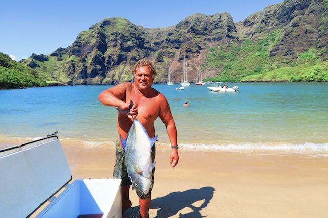 Hakaui Valley Vaipo Waterfall fisherman Nuku Hiva Marquesas Islands French Polynesia