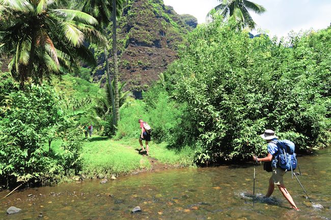 Hakaui Valley Vaipo Waterfall hike crossing river Nuku Hiva Marquesas Islands French Polynesia