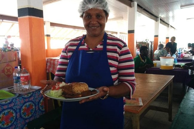 Local Woman serving lunch in Lunch In Port Vila Central Market - Vanuatu