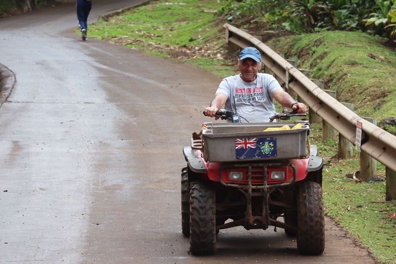 Pitcairn Island - local on ATV in hill of difficulty