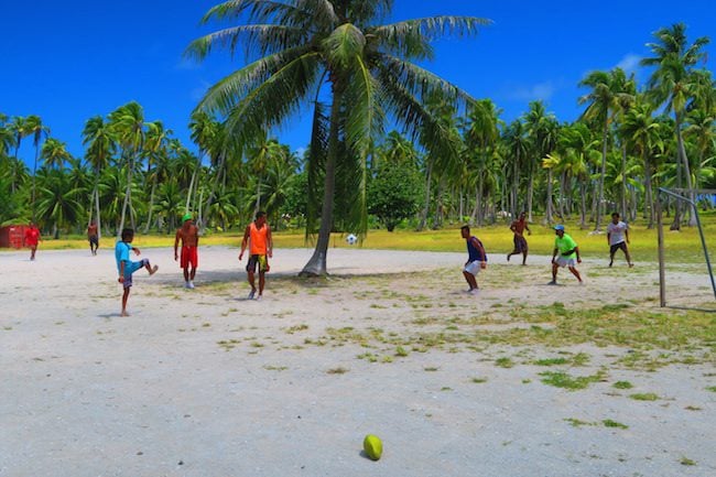 Tahitians playing soccer Rangiroa French Polynesia