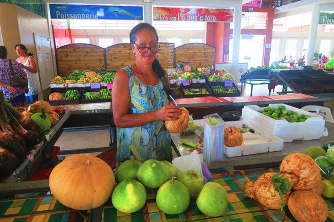 Uturoa Market Raiatea Island French Polynesia drinking coconut