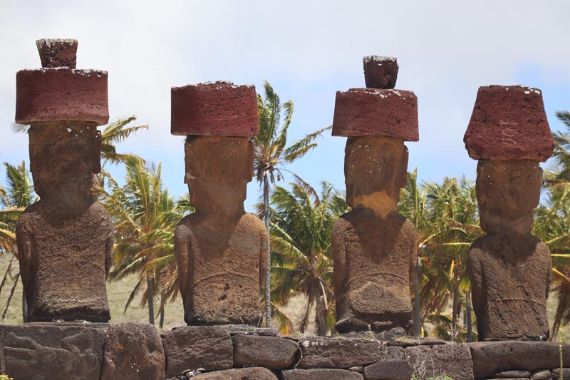 decorated backs of moai in Ahu Nau Nau - Easter Island