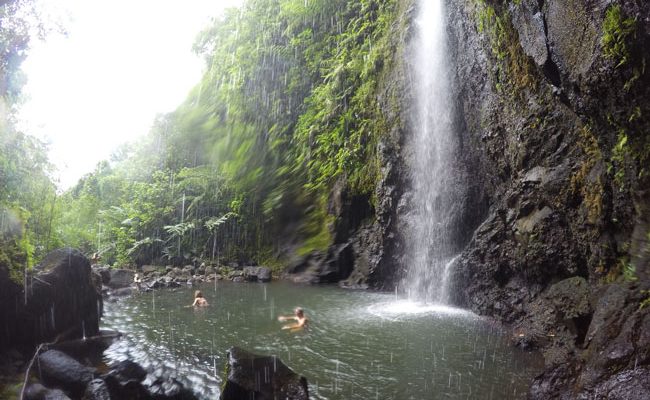 les trois cascades three waterfalls Raiatea Island French Polynesia behind waterfall