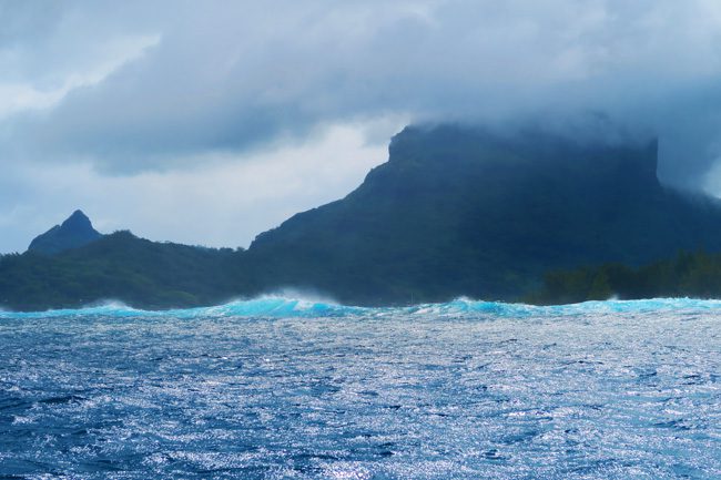 waves outside lagoon in bora bora french polynesia