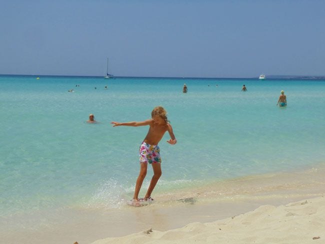 Kid playing at Es Trenc Mallorca nude beach Spain