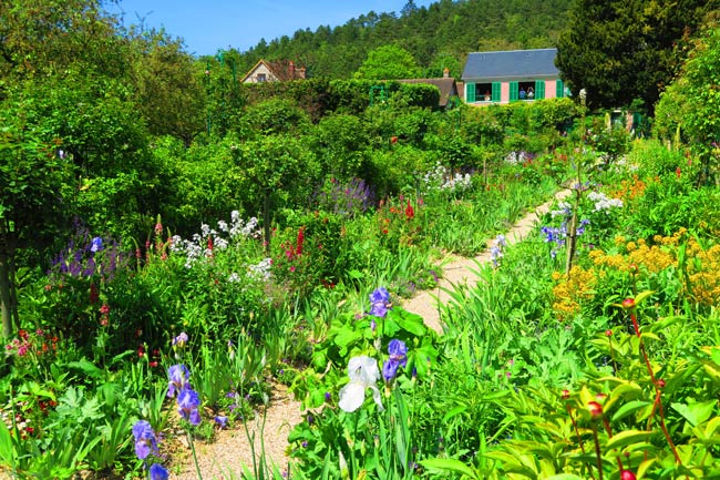 Monet garden Giverny flower row with house
