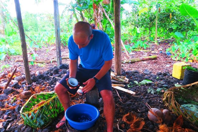 Making Umu in Samoa scraping coconuts