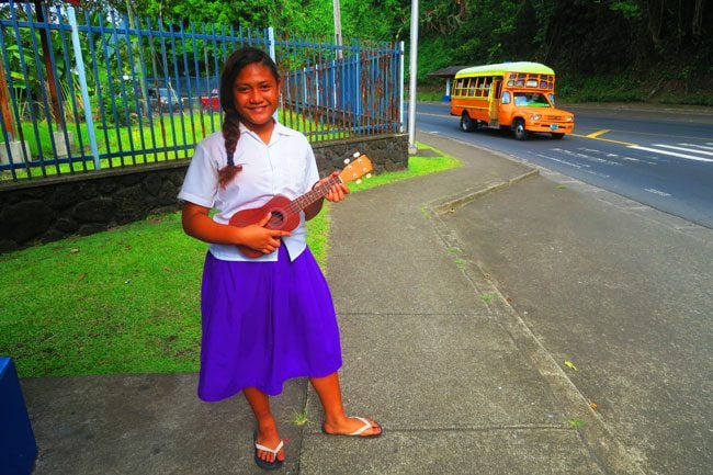 Girl playing ukelele in Pago Pago American Samoa