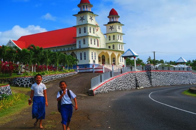 Sleepy Village Savaii Samoa - kids next to church