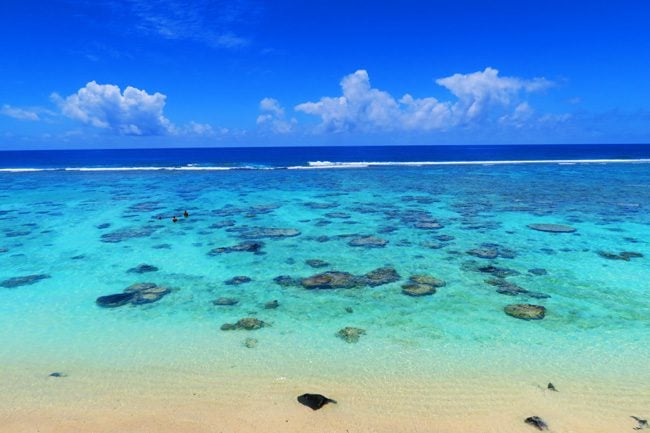 Black Rocks Tropical beach in Rarotonga Cook Islands