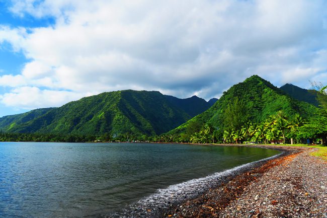 Black sand beach in Tehaupoo Tahiti French Polynesia