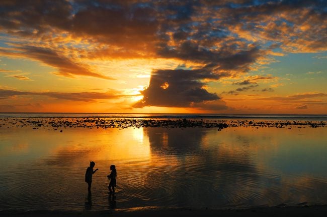 Sunset in Rarotonga Cook Islands children playing