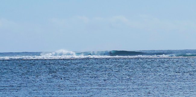 Surfer in Teahupoo Beach Tahiti French Polynesia