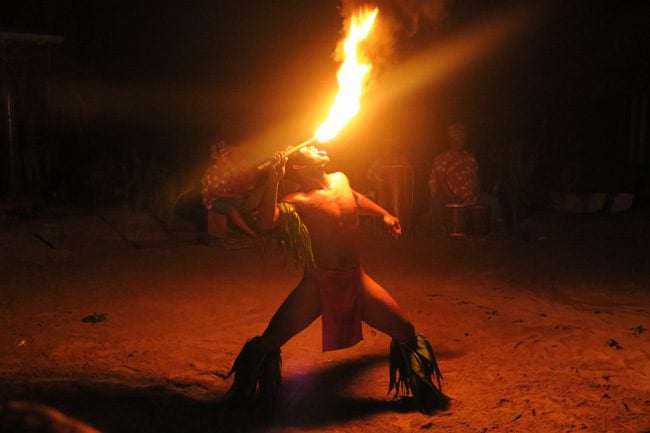 Tiki Village Moorea fire show licking fire