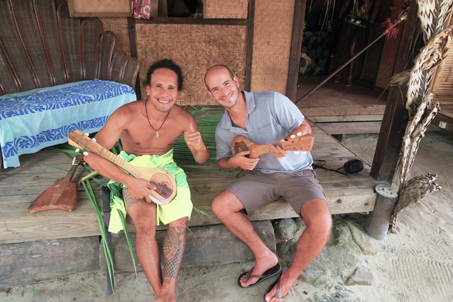 Tiki Village Moorea playing ukelele