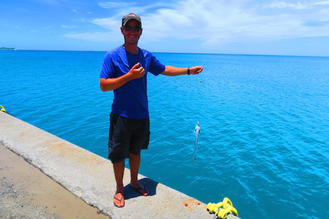 Fishing off pier Fakarava Atoll French Polynesia