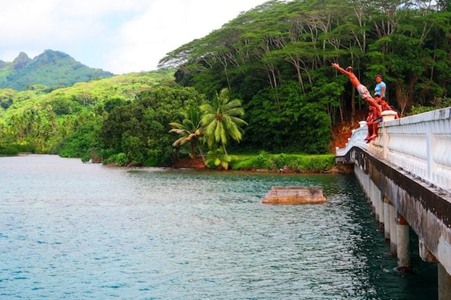 jumping off bridge Huahine Island French Polynesia