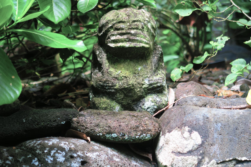 Tiki statue in Hakaui Valley Vaipo Waterfall hike Nuku Hiva Marquesas Islands French Polynesia