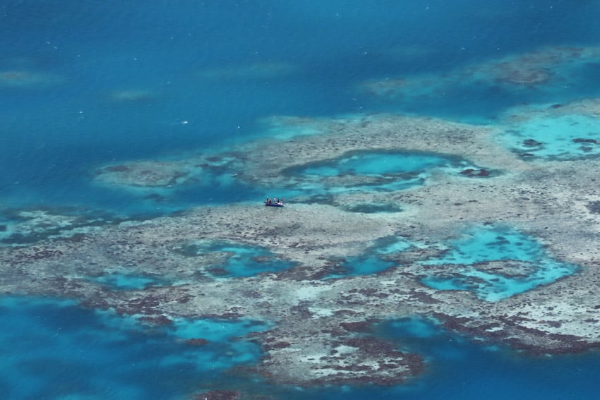 fishermen in lagoon from Mount Teurafaatiu Hike Maupiti French Polynesia.