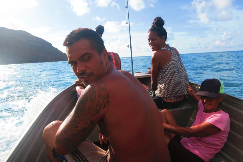 locals in boat - Hiva oa Marquesas Islands French Polynesia
