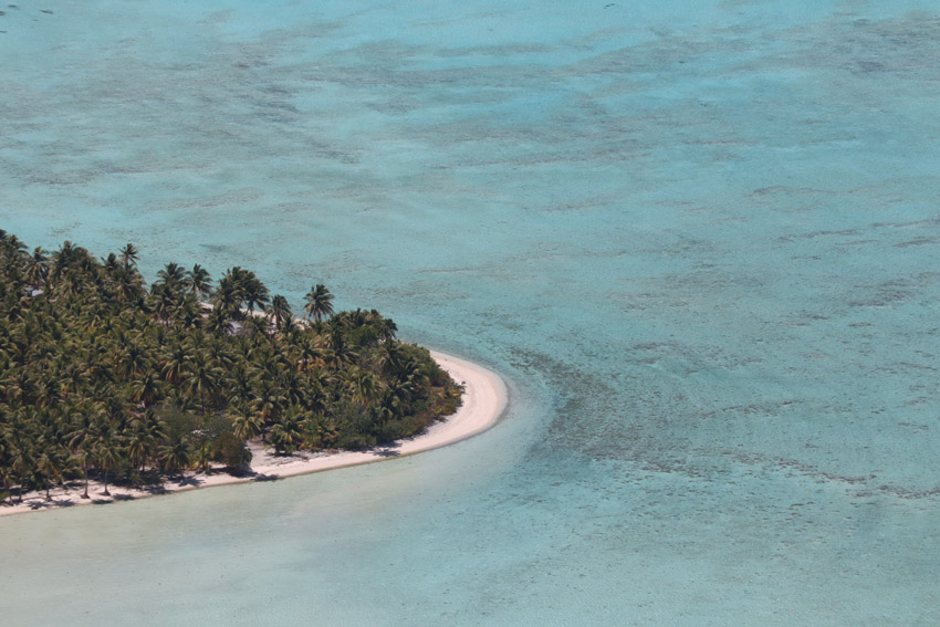 tropical beach from Mount Teurafaatiu Hike Maupiti French Polynesia.