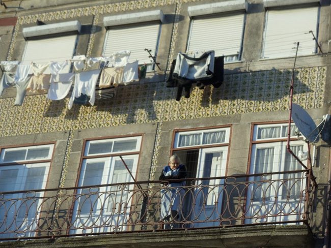 Cai Ribeira - Porto - Portugal - Old Woman hanging laundry