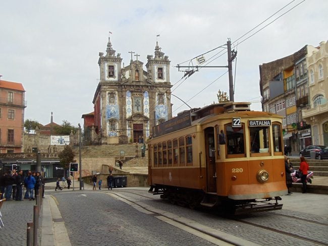 Tiled church of Santo Ildefonso and street tram - Porto - Portugal