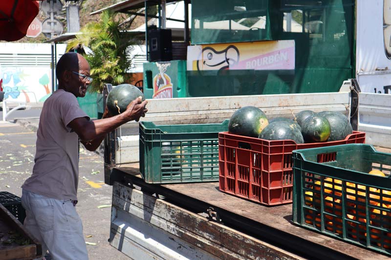 St Paul market Reunion Island - local carrying watermelon