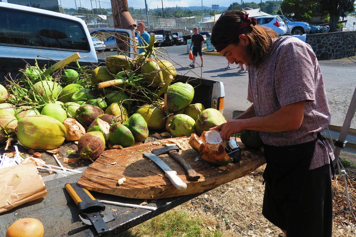 Cracking coconuts at the Pure Kona Green Farmers Market - Big Island Hawaii