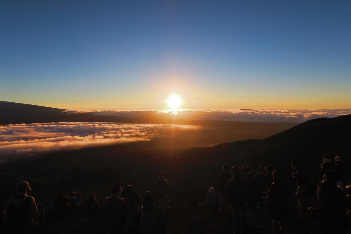 Sun setting above clouds on Mauna Kea - Big Island