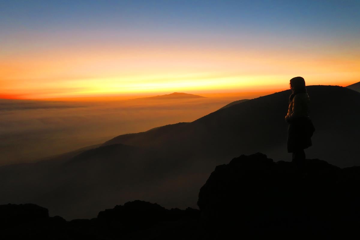 Sunset on Mauna Kea - Woman watching sunset - Big Island Hawaii