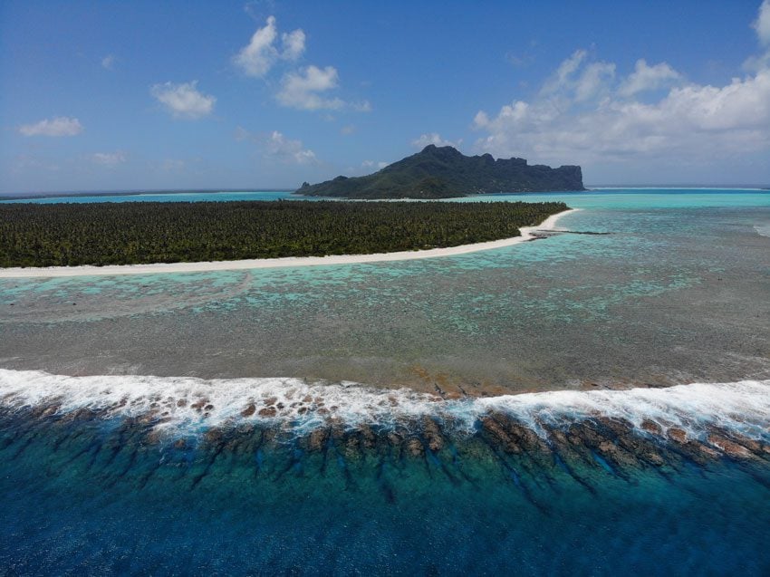 Aerial view of Maupiti coral reef and main island - French Polynesia