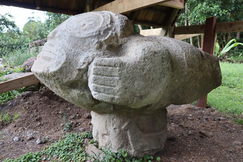 Stone statue giving birth in Lipona site - Hiva Oa - Marquesas Islands - French Polynesia