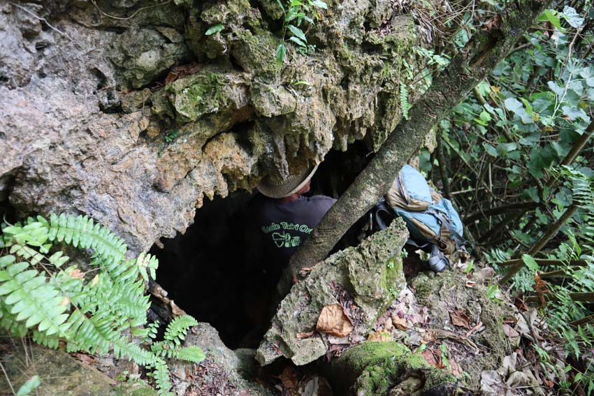 entering secret cave - rurutu - austral islands - french polynesia