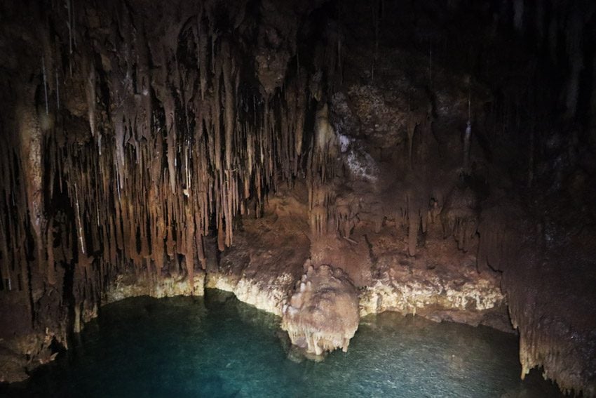 natural pool in secret cave - rurutu - austral islands - french polynesia