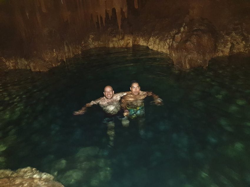 swimming in natural pool - secret cave - rurutu - austral islands - french polynesia