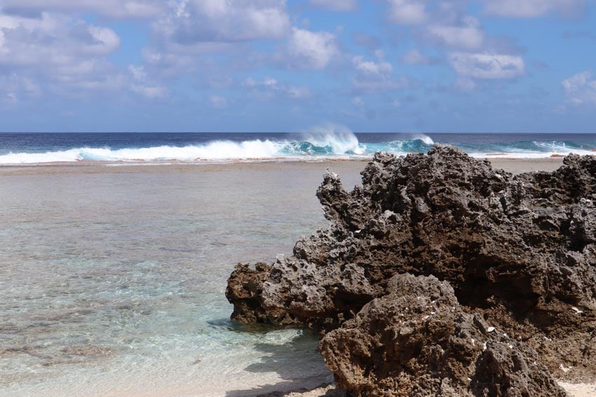 wave breaking on reef - tikehau - french polynesia