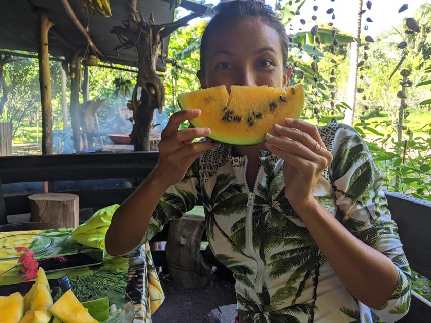 dricia eating yellow watermelon - Hakaui Valley - nuku hiva - marquesas islands - french polynesia