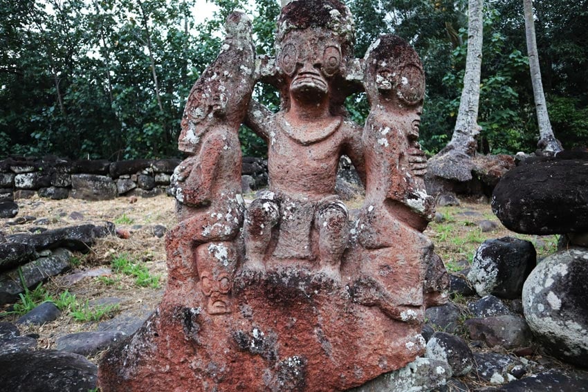 three headed statue Hikokua archeological site - nuku hiva - marquesas islands - french polynesia