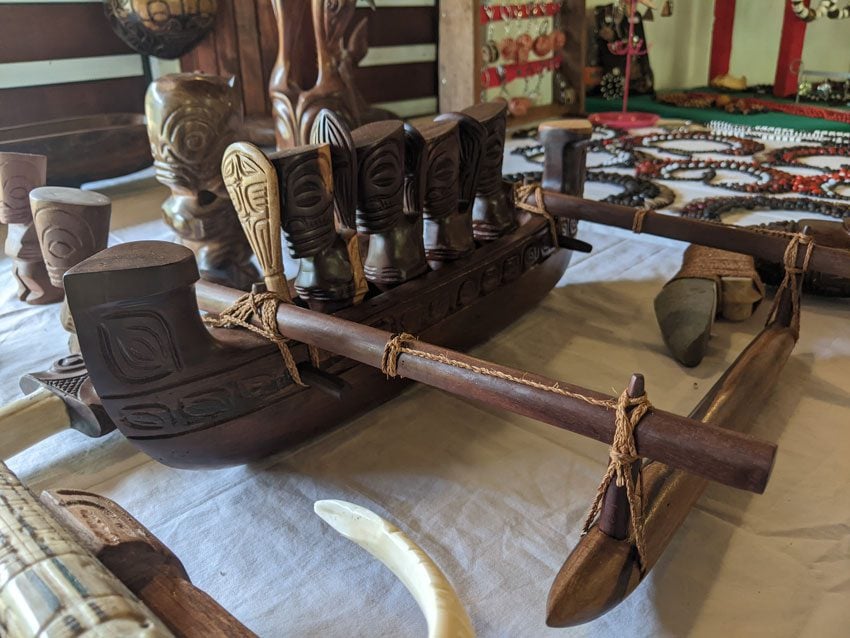 wooden carvings at taipivai crafts market - nuku hiva - marquesas islands - french polynesia
