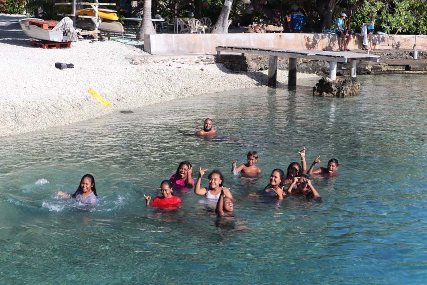 Local children swimming in Rangiroa French Polynesia