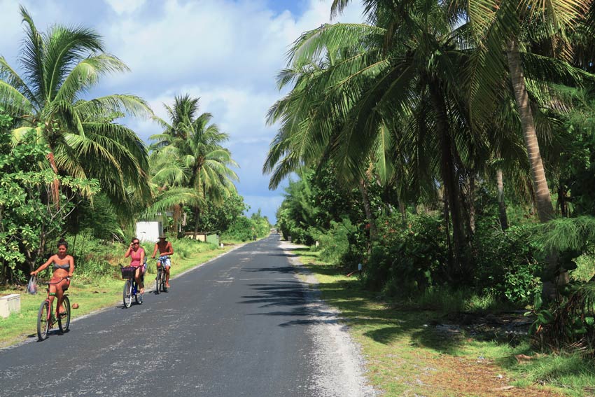 Locals cycling in Rangiroa French Polynesia