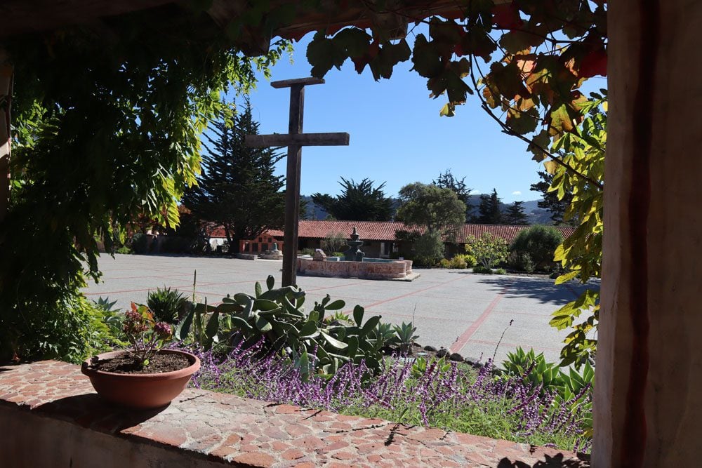 cross in courtyard carmel mission - pacific coast highway