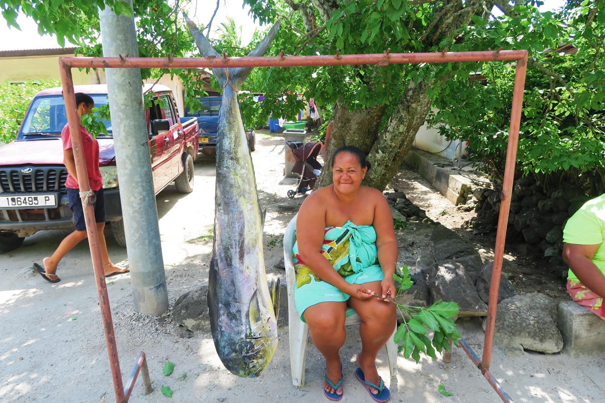 Mahi mahi fish sold by local woman in Maupiti
