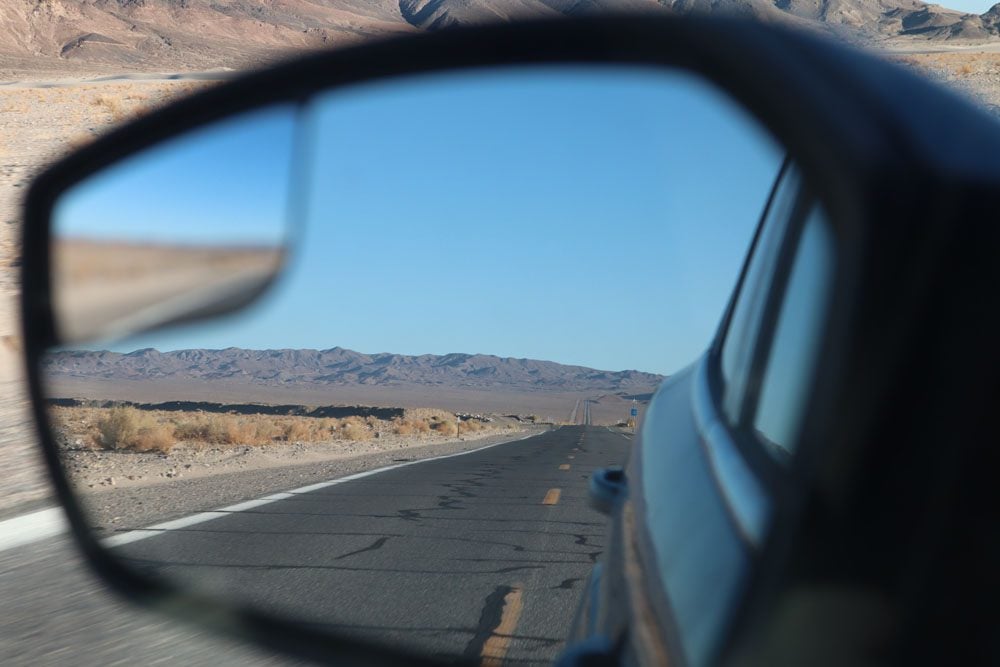 view from side mirror scenic Highway 127 death valley
