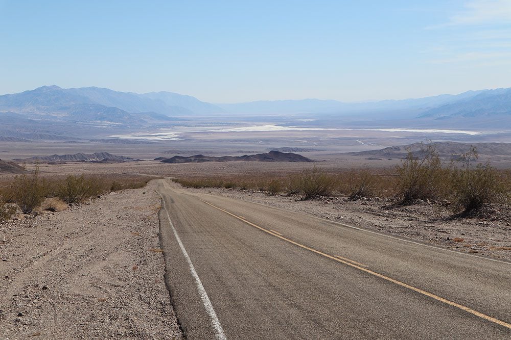 driving in death valley - straight desert road