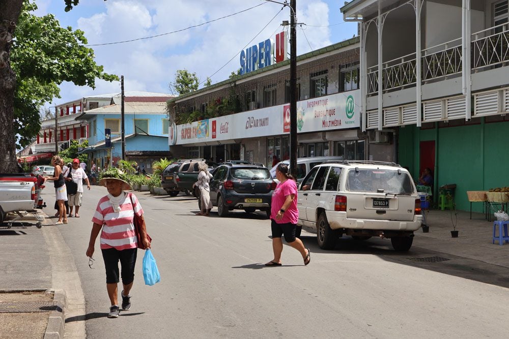 Locals walking in fare Village Huahine French Polynesia